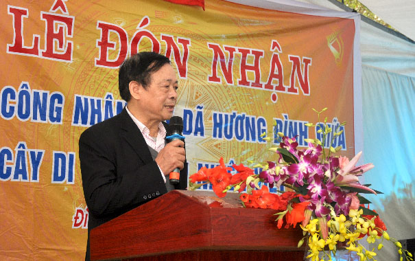 A person speaking into a microphoneDescription automatically generated