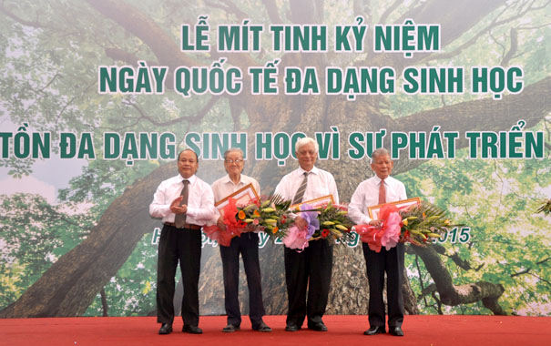 A group of men standing on a red carpetDescription automatically generated with medium confidence