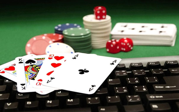 A close-up of poker chips and cardsDescription automatically generated