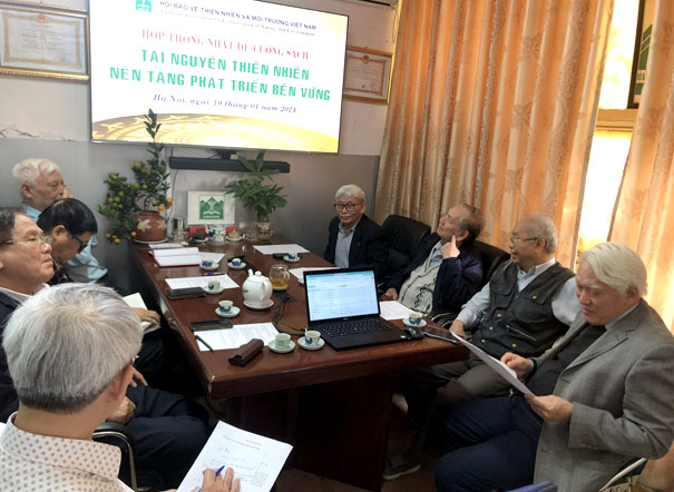 A group of people around a tableDescription automatically generated