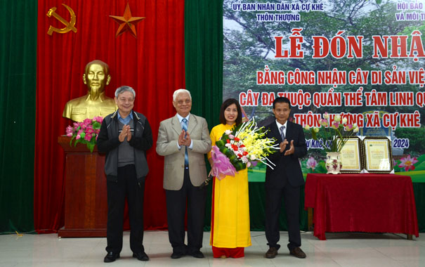 A group of people standing in front of a podiumDescription automatically generated