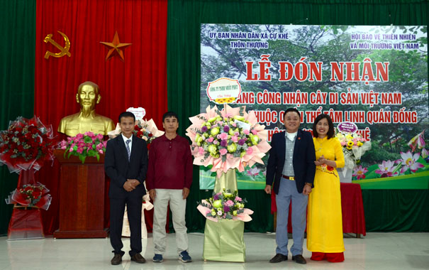 A group of people standing in front of a stageDescription automatically generated