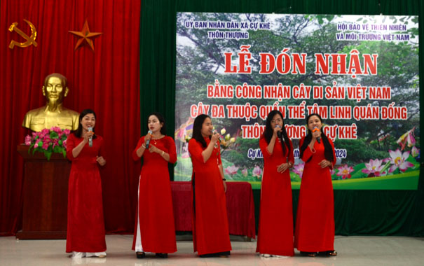 A group of women singing on stageDescription automatically generated