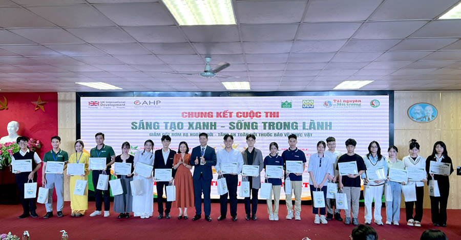 A group of people holding signsDescription automatically generated