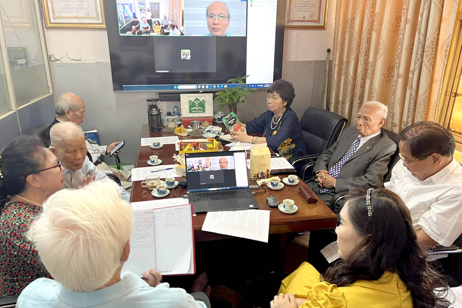 A group of people sitting around a tableDescription automatically generated