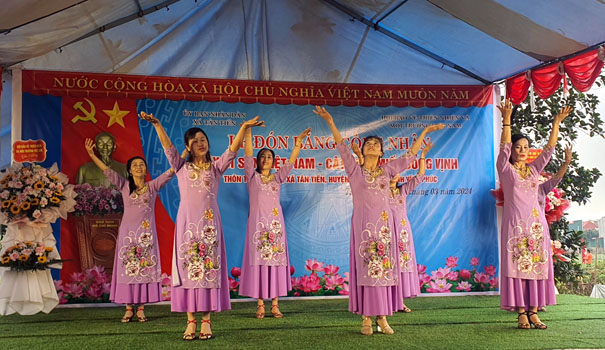 A group of women performing on a stageDescription automatically generated