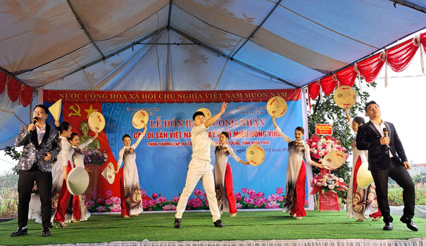 A group of people dancing on a stageDescription automatically generated