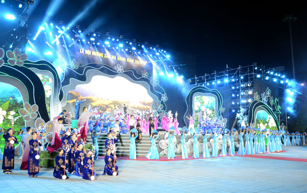 A group of people in blue dresses on stageDescription automatically generated
