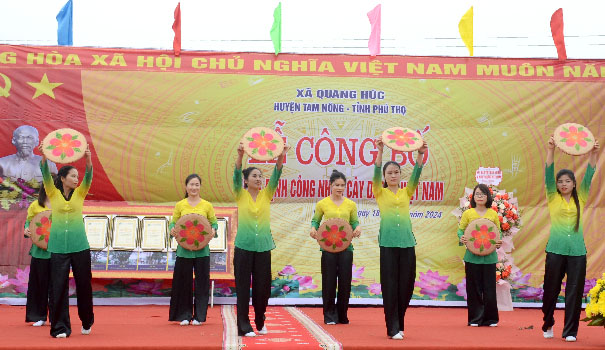 A group of people performing on a stageDescription automatically generated