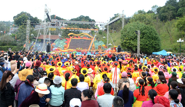 A large crowd of people in colorful outfitsDescription automatically generated