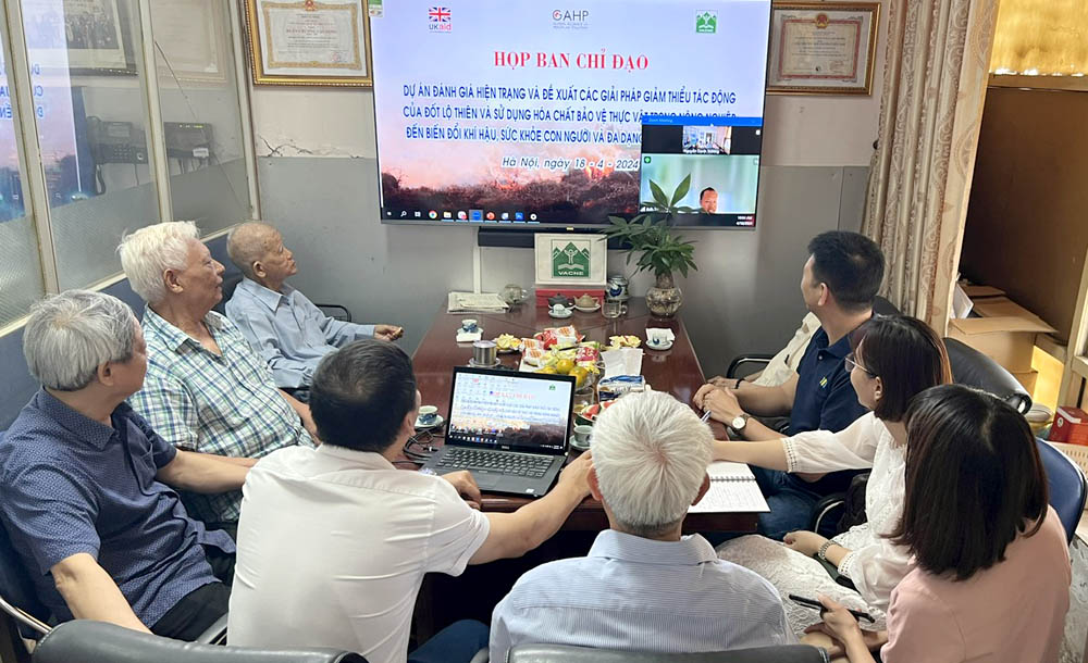 A group of people sitting around a tableDescription automatically generated