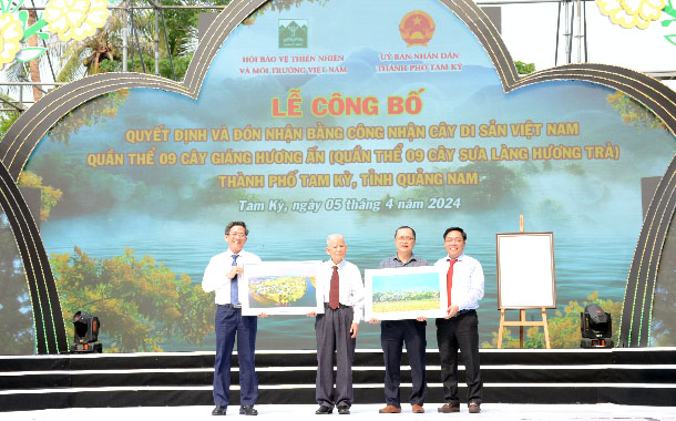 A group of men holding up postersDescription automatically generated