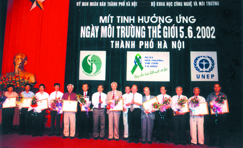 A group of people holding signsDescription automatically generated