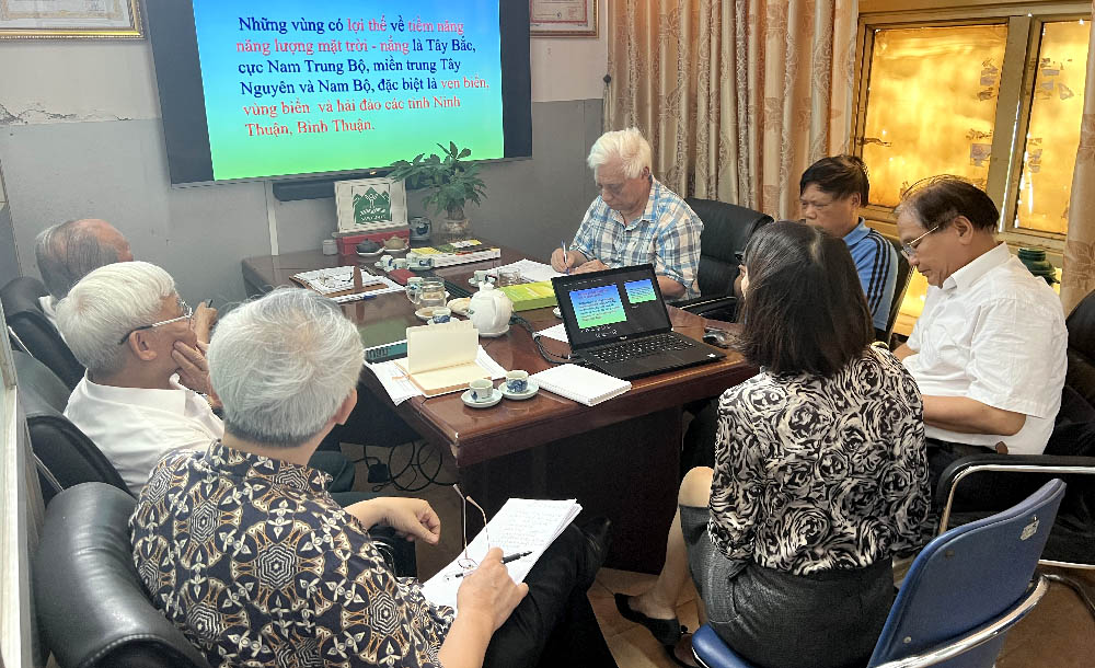 A group of people around a tableDescription automatically generated