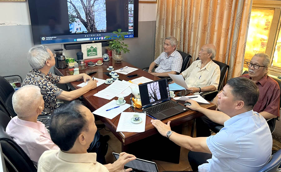 A group of people around a tableDescription automatically generated