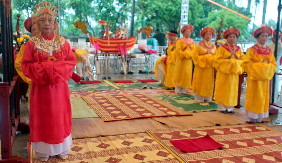 A group of people in a red dressDescription automatically generated
