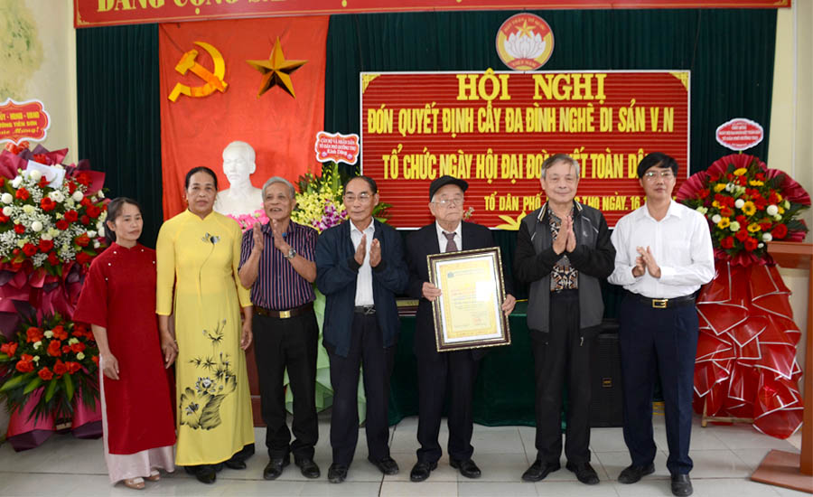 A group of people standing in front of a bannerAI-generated content may be incorrect.