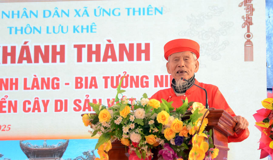 A person standing at a podium with flowersAI-generated content may be incorrect.