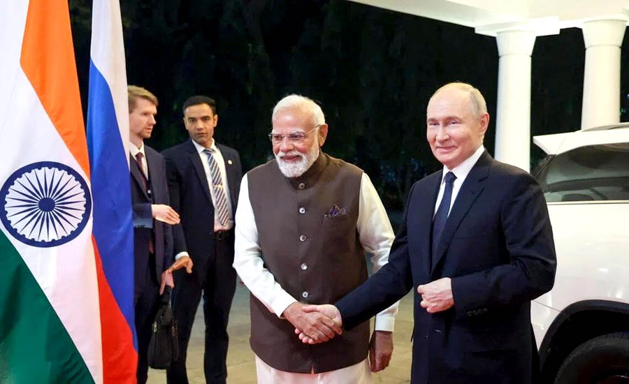 Two men shaking hands in front of a flagAI-generated content may be incorrect.