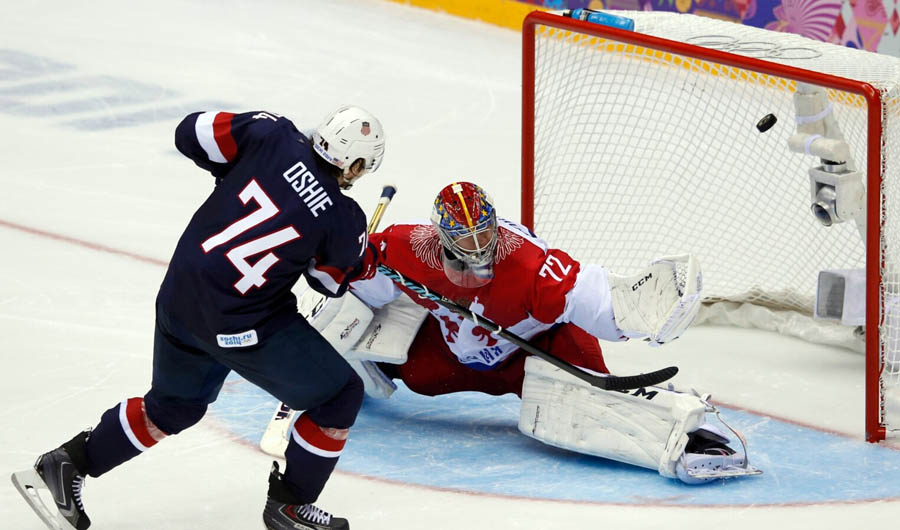 Hockey players in a hockey gameAI-generated content may be incorrect.