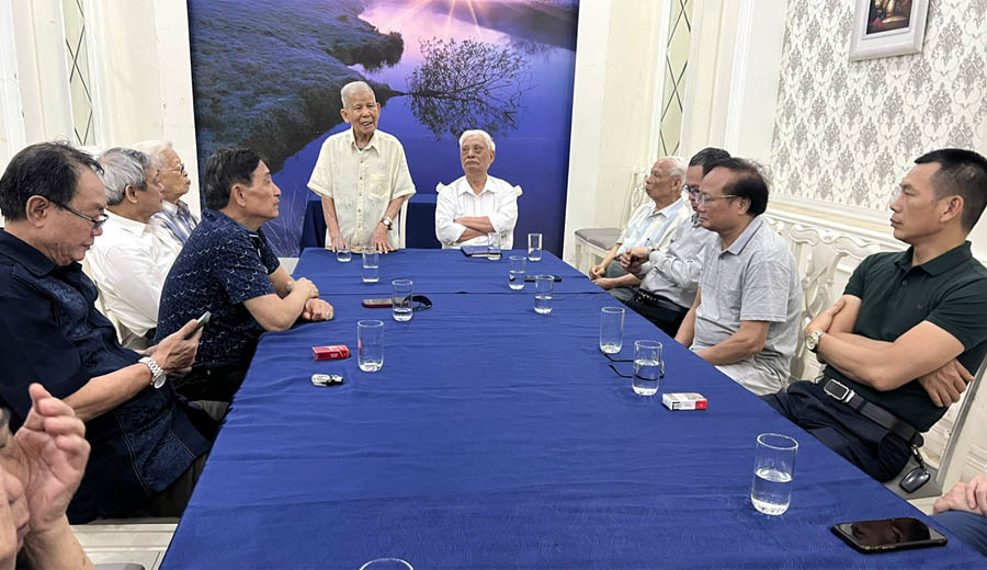 A group of men sitting around a tableAI-generated content may be incorrect.